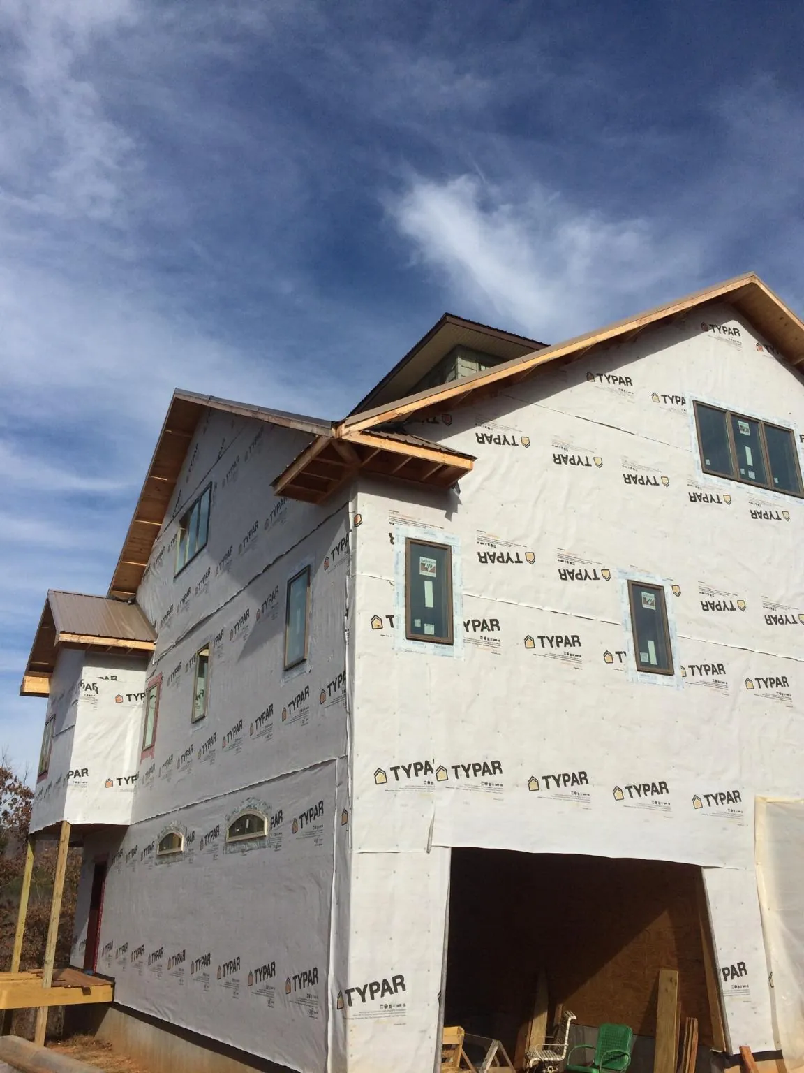 Stick built house wrapped in Typar with new roof framing and dormers in Grass Valley